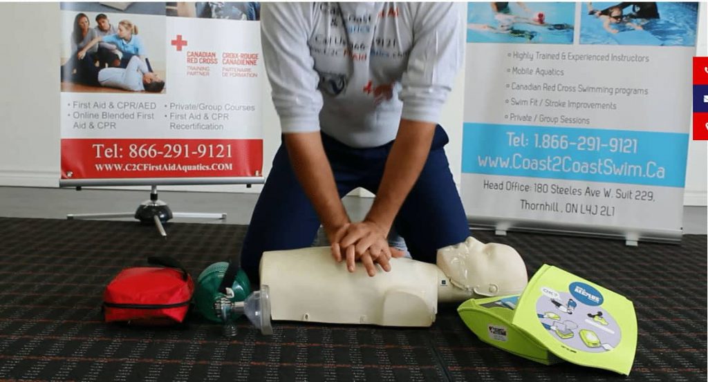a person doing CPR in a mannequin