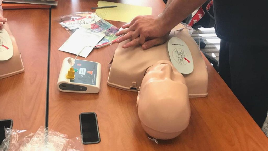 a person doing cpr on a mannequin
