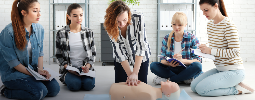 Private CPR class – CPR training demonstration with students observing and taking note