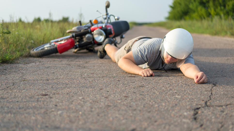 A rider fell down from his motorcycle.