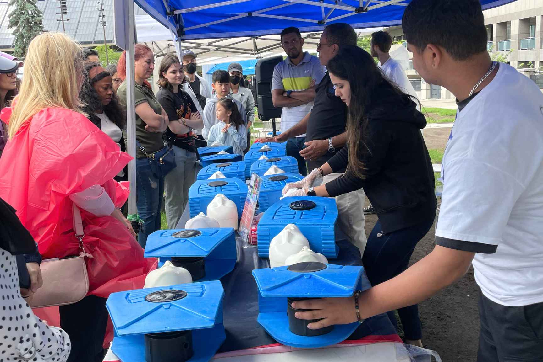 A group of people learning and practicing CPR training on the training mannequins 