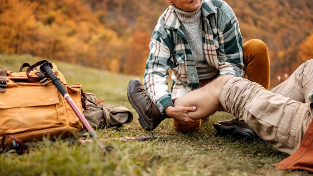 a person helping a hiker