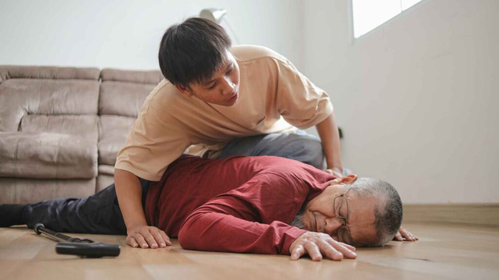 a person on the floor suffering a heart attack