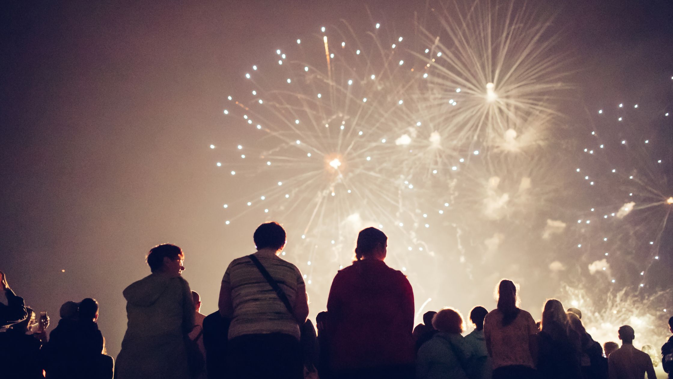 Family maintaining safe distance from Canada Day fireworks display as per first aid guidelines