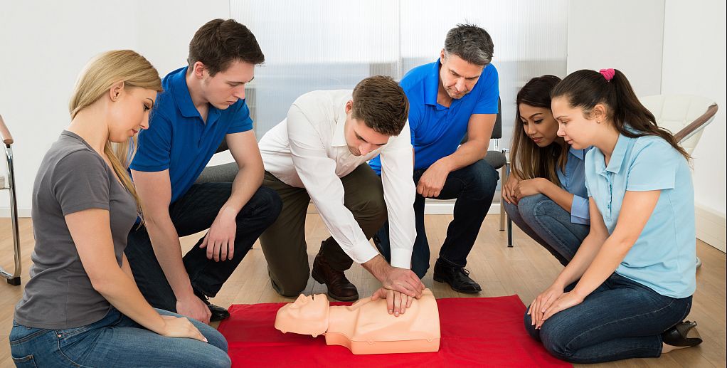 Group First Aid CPR practical training with mannequins at Coast2Coast Vancouver facility
