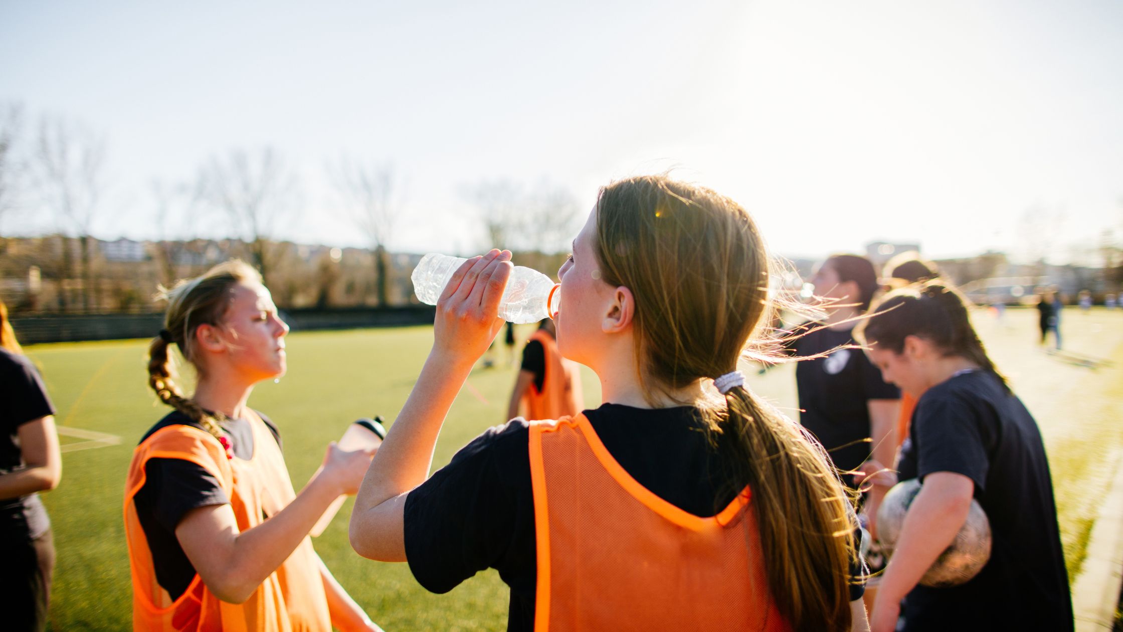 Applying cold compress for heat exhaustion during outdoor Canada Day celebrations